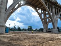 a construction scene of the roadway overpass near an intersection that is under construction, with a sky background