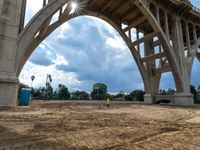 a construction scene of the roadway overpass near an intersection that is under construction, with a sky background