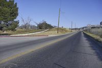a deserted road has been closed and is mostly empty or is not yet to be used