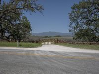 this is an image of the entrance to a ranch gate on the side of the road