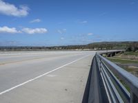 an empty highway in rural country with no people standing or laying at the side of it