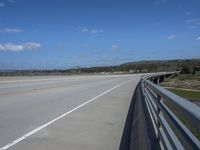 an empty highway in rural country with no people standing or laying at the side of it