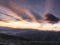 Rural California: An Open Road amidst Grass and Mountains