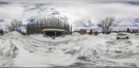 an image of snow piled in front of a house on the side of a road