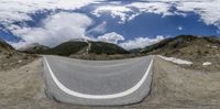 this is an image of a road in the mountains above a mountain range to depict a time lapsing