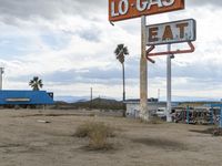 a gas station has been altered to look like an old gas sign in desert area