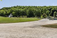 a woman running in a park in the middle of the day, with people on the other side