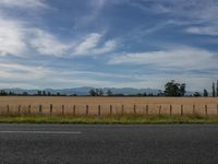 Rural Landscape: Clouds Floating Over a Green Grass Field