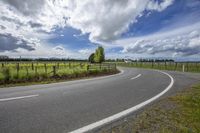 Rural Landscape with Curved Road and Green Vegetation