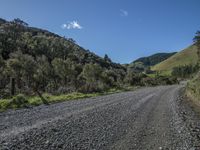 an empty road leading through some mountains in the wilds of africa / andean