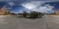 a 3d view of a road from the ground with a cloud and blue sky above