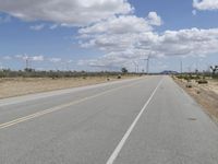 Road Through a Rural Landscape: Fields and Clear Skies