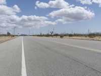Road Through a Rural Landscape: Fields and Clear Skies