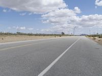 Road Through a Rural Landscape: Fields and Clear Skies