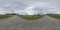 a group of three 360 - spherical panoramic pictures of a rural area, two trees and the dirt road