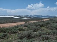 Rural Landscape in Utah: Dirt Road Leading to a Beautiful Lake