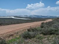 Rural Landscape in Utah: Dirt Road Leading to a Beautiful Lake