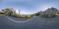 three fisheye lens shots showing a truck going down the road with a large stone building in the background