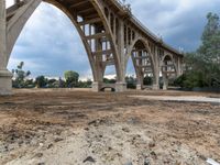 an empty park and bridge is under construction in the country side of los angeles ca