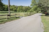 Rural Road Under Clear Sky: A Serene Landscape