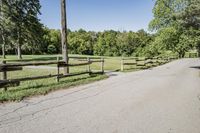 Rural Road Under Clear Sky: A Serene Landscape