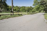 Rural Road Under Clear Sky: A Serene Landscape