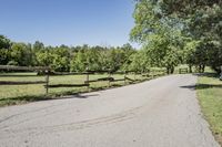 Rural Road Under Clear Sky: A Serene Landscape