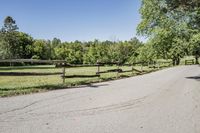 Rural Road Under Clear Sky: A Serene Landscape