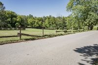 Rural Road Under Clear Sky: A Serene Landscape