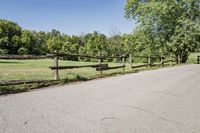 Rural Road Under Clear Sky: A Serene Landscape