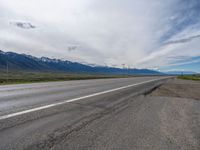 Rural Road in Colorado: A Cloud-Filled Sky Above