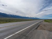 Rural Road in Colorado: A Cloud-Filled Sky Above