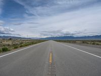 Rural Road in Colorado: Scenic Mountain Views