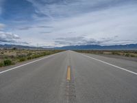 Rural Road in Colorado: Scenic Mountain Views