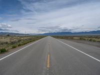 Rural Road in Colorado: Scenic Mountain Views