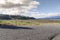 Rural Road in Highland: Lake and Mountain Views