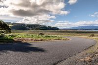 Rural Road in Highland: Lake and Mountain Views