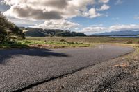 Rural Road in Highland: Lake and Mountain Views