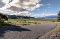 Rural Road in Highland: Lake and Mountain Views