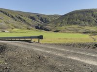 Rural Road in Iceland's Highland Surrounded by Grass