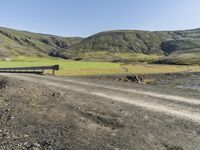 Rural Road in Iceland's Highland Surrounded by Grass