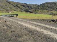 Rural Road in Iceland's Highland Surrounded by Grass