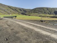 Rural Road in Iceland's Highland Surrounded by Grass