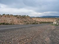 Rural Road in Utah: Scenic Mountains and Clouds