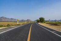 Rural Thailand Road: Yellow Field and Scenic Landscape