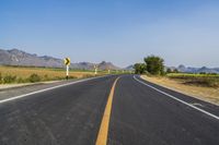 Rural Thailand Road: Yellow Field and Scenic Landscape