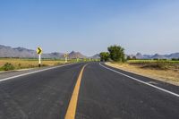 Rural Thailand Road: Yellow Field and Scenic Landscape