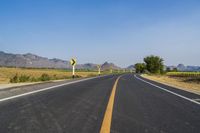 Rural Thailand Road: Yellow Field and Scenic Landscape