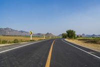 Rural Thailand Road: Yellow Field and Scenic Landscape