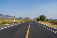 Rural Thailand Road: Yellow Field and Scenic Landscape